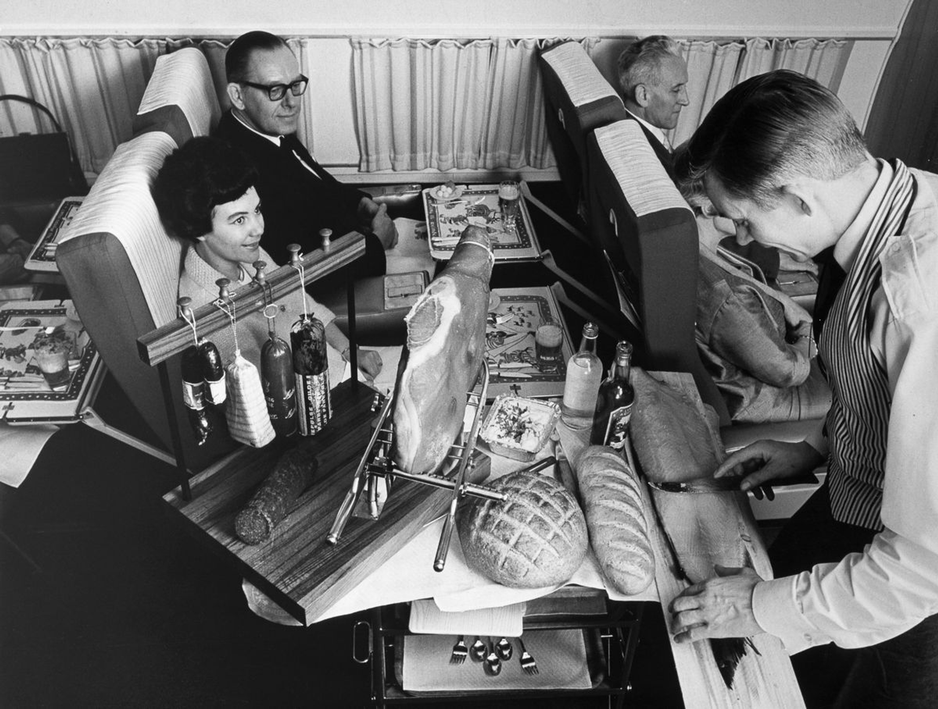 c.-1965-First-class-meal-service-aboard-a-DC-8.